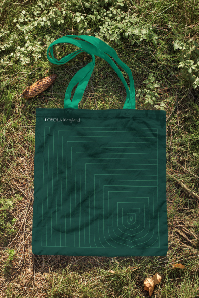 Green Loyola Maryland tote bag with geometric shield pattern